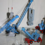 Fuchs 118 mit Schlitzwandgreifer und 118 M mit umschlaggreifer vorne