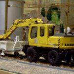 2-Wegebagger mit Abrollcontainer